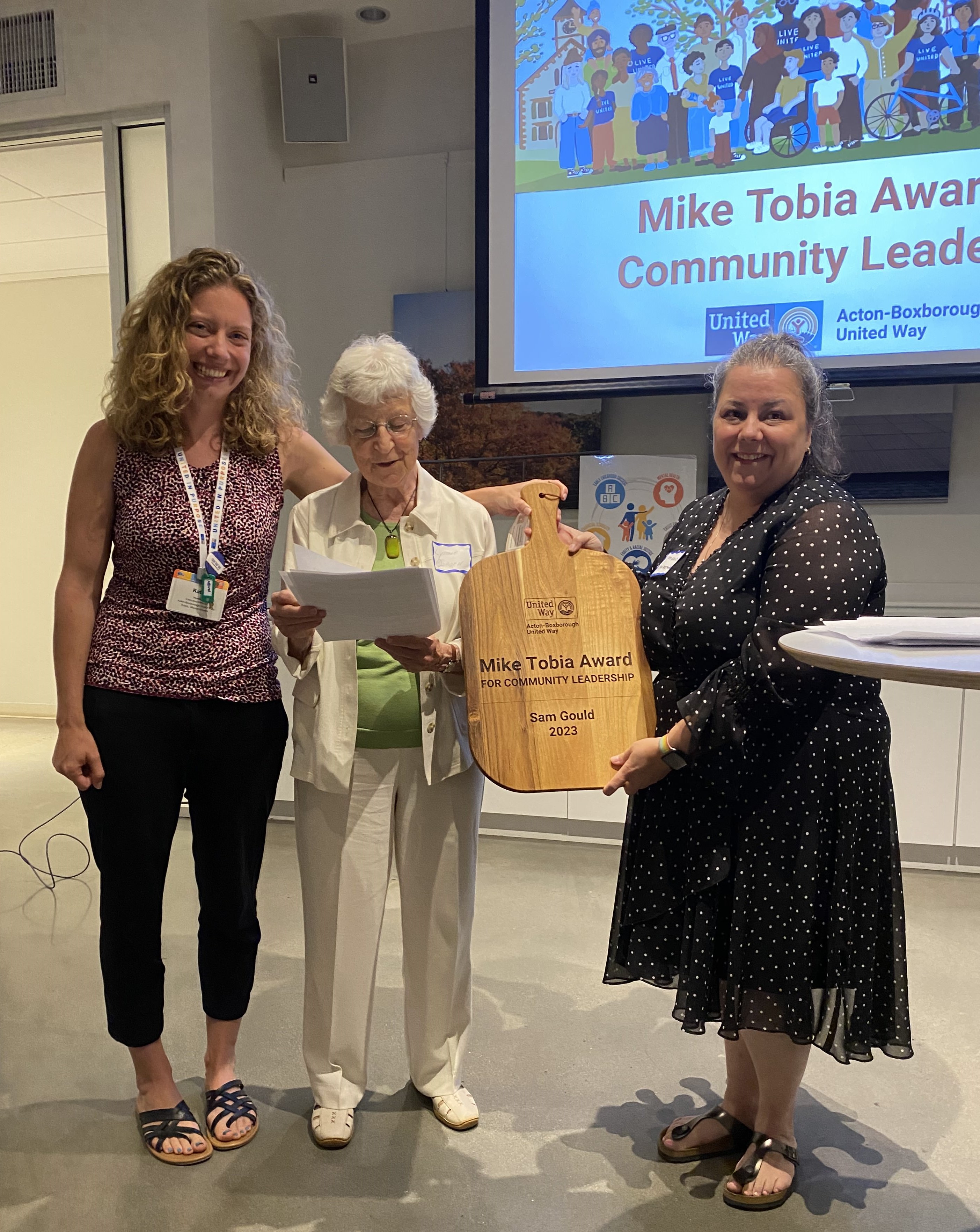 ABUW Executive Director Katie Neville and 2022 Award Recipient Lynne Osborn present Sam Gould with Mike Tobia Award