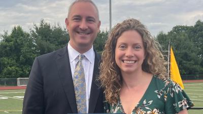 Pictured: AB Superintendent Peter Light presents the 2024 William L. Ryan Community Service Award to ABUW Executive Director Katie Neville